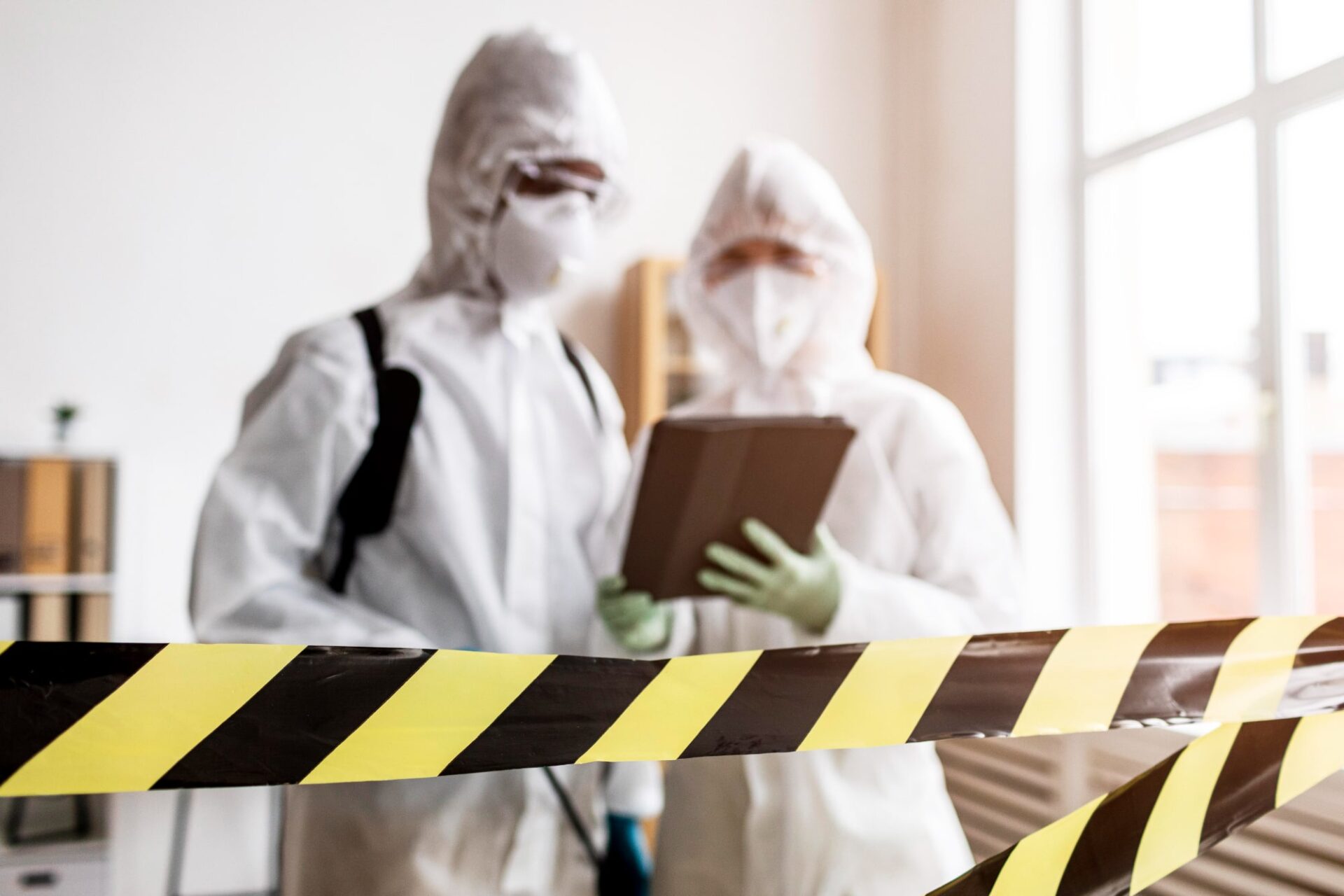 Asbestos removalist wearing protective gear while safely removing hazardous materials, demonstrating trusted asbestos removalist services.